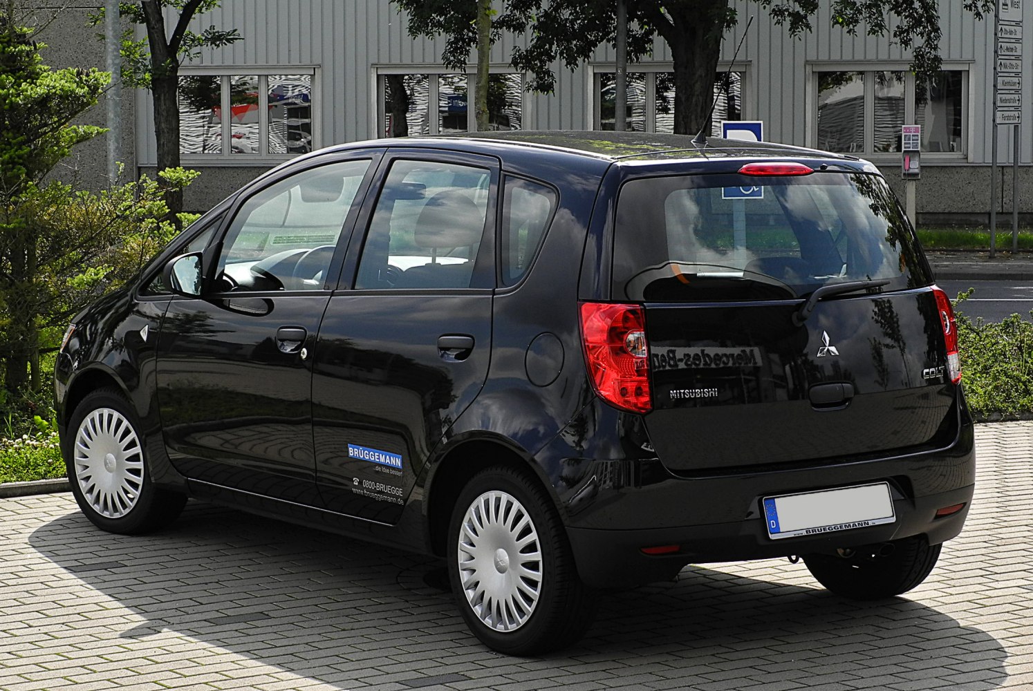 Compact black five-door hatchback, rear and side view, distinct taillights