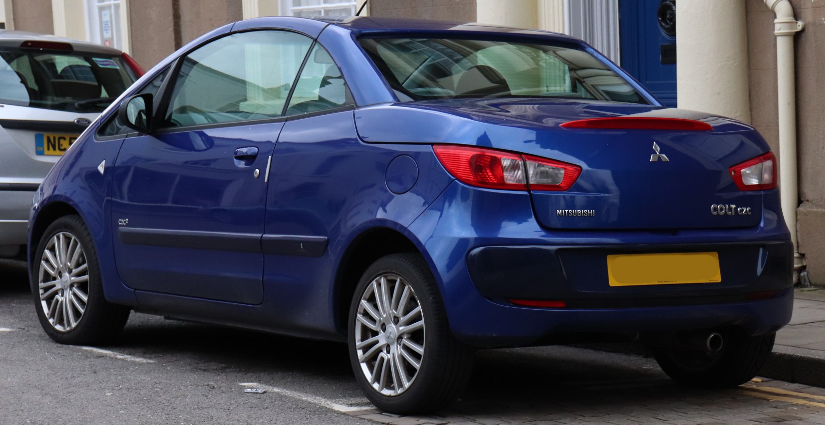 Rear side view of convertible with tail lights and alloy wheels