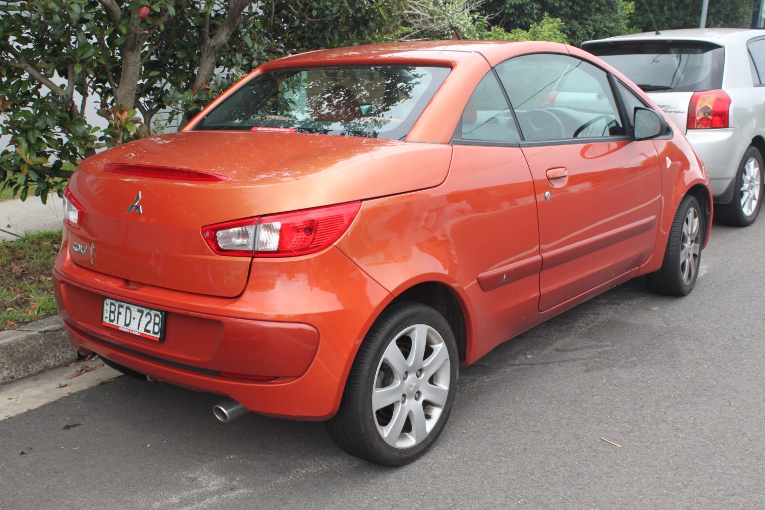 Rear view of compact hatchback with distinctive taillights and sporty design