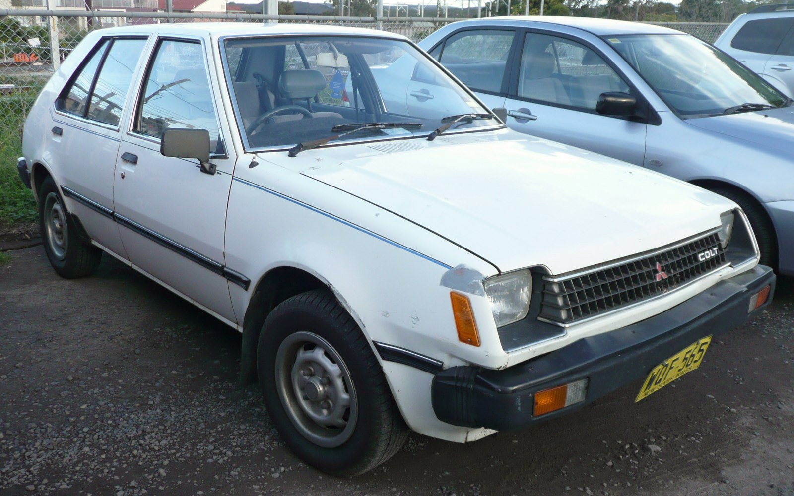 Vintage hatchback with rectangular headlights and black bumper