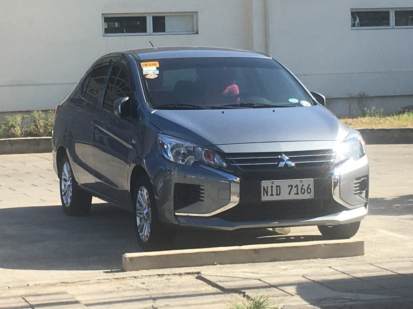 Front view of compact sedan with updated headlights and grille