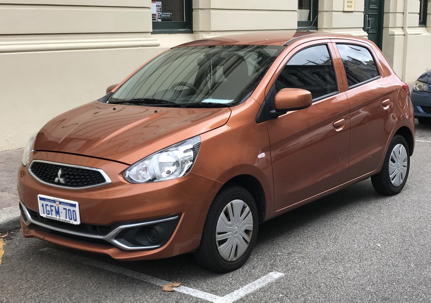 Front-side view of a compact hatchback with modern headlights