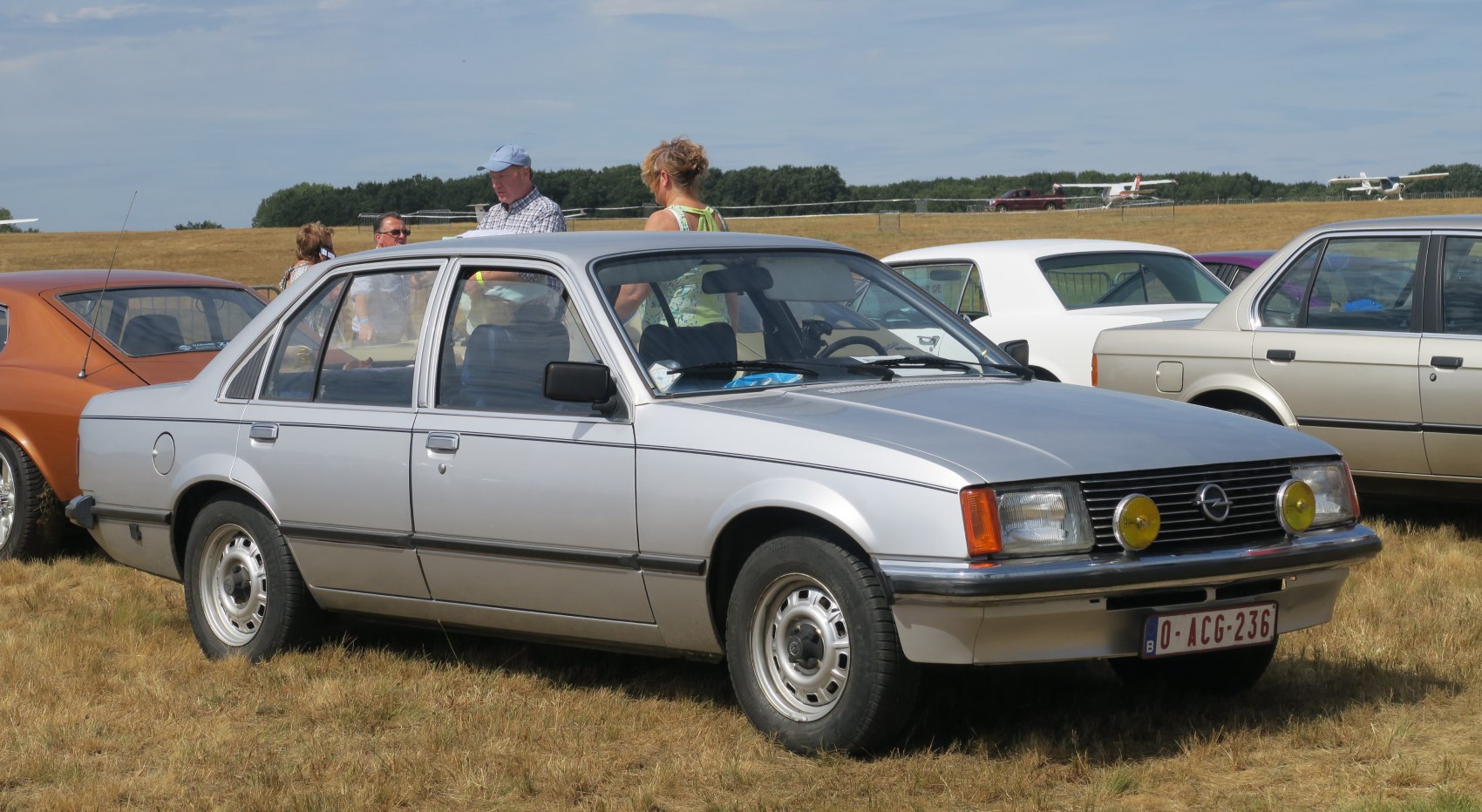 Classic four-door sedan with square headlights and yellow round fog lamps