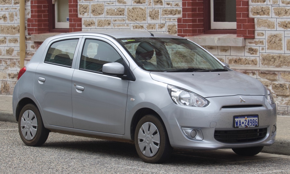 Silver compact hatchback with fog lights and five doors