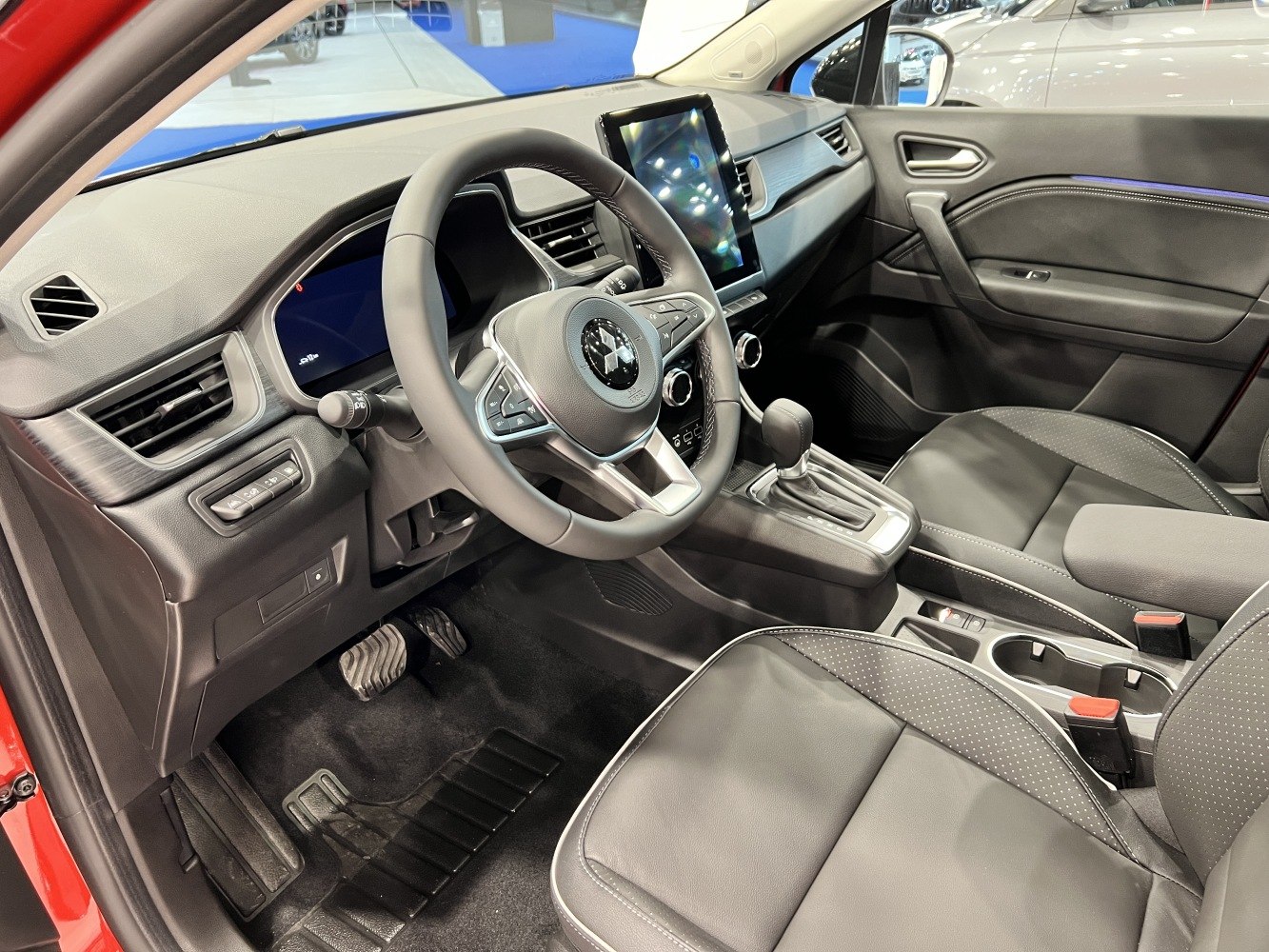Modern car interior with digital dashboard and sleek steering wheel