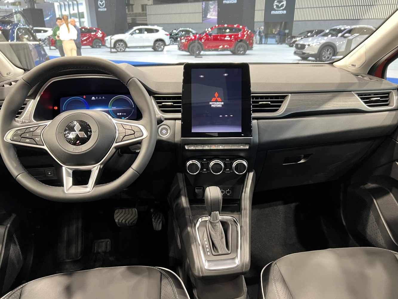 Digital instrument cluster and vertical central touchscreen inside car dashboard