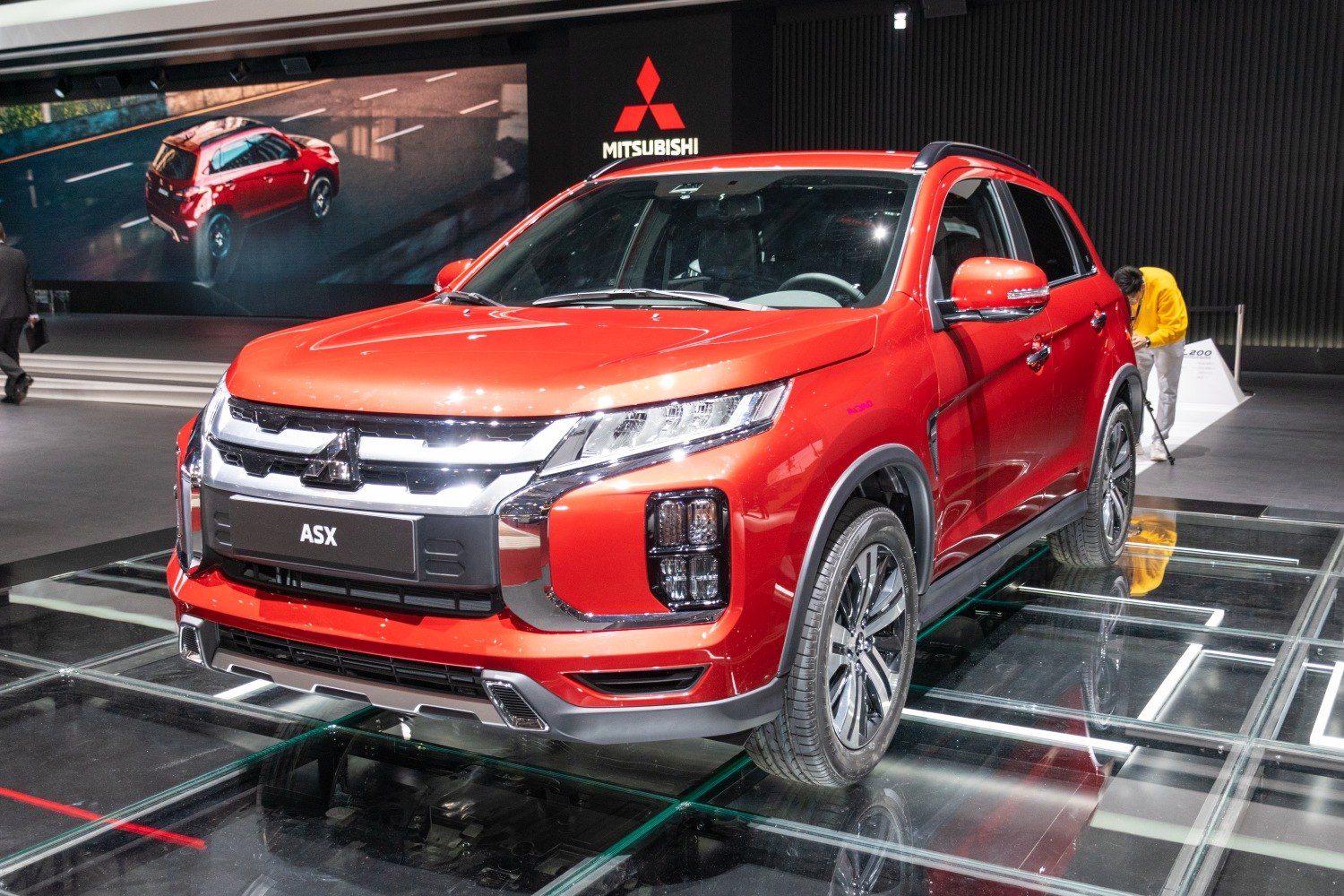 Front view with LED headlights, grille, and alloy wheels