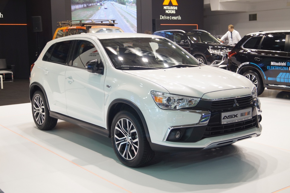 Front and side profile of white compact SUV with alloy wheels and modern headlights