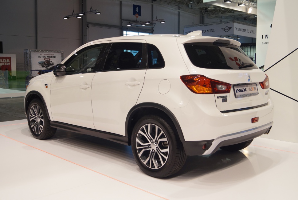 White compact SUV rear side with alloy wheels and modern design
