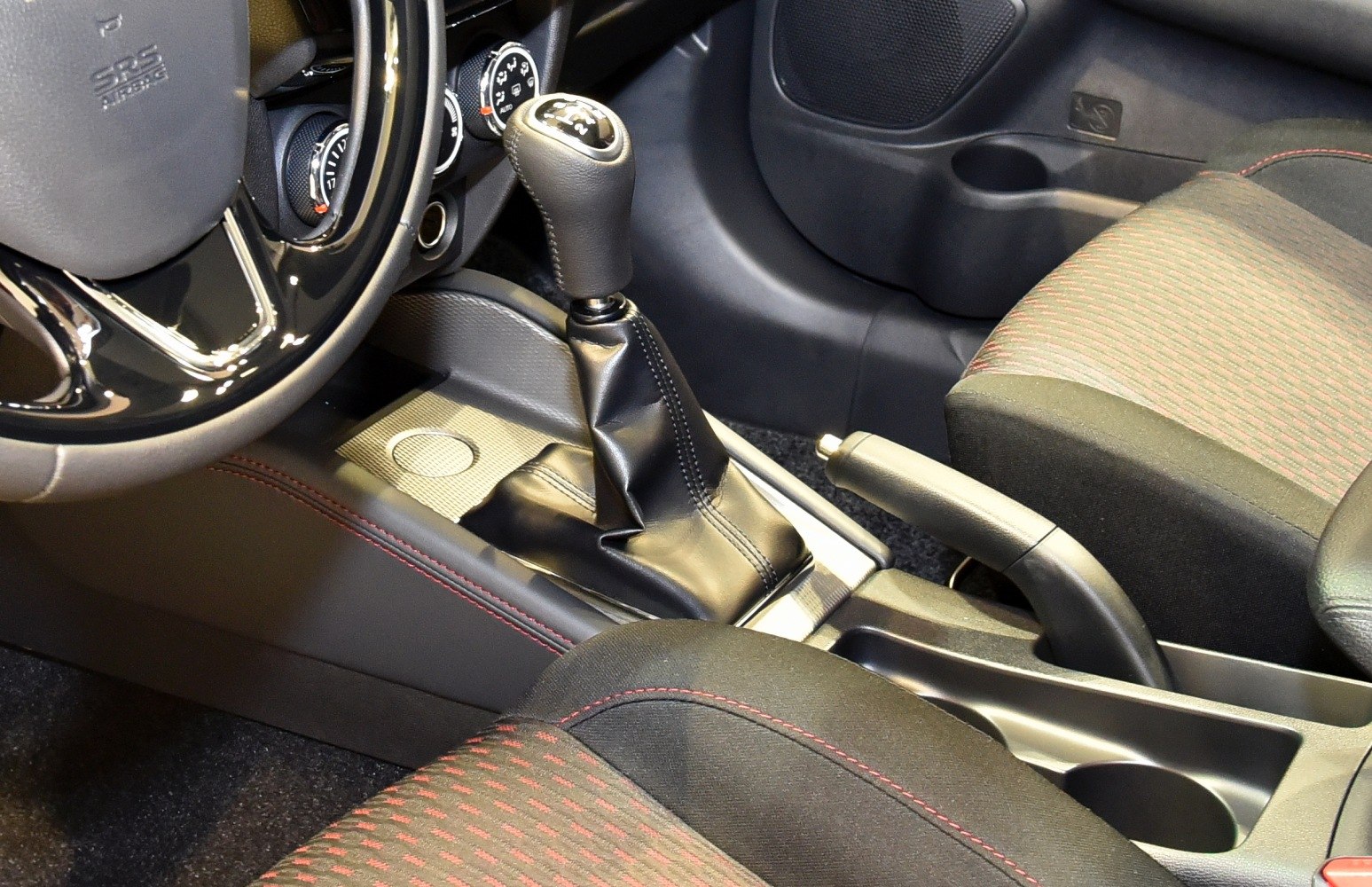Manual gear shift lever and handbrake in car interior