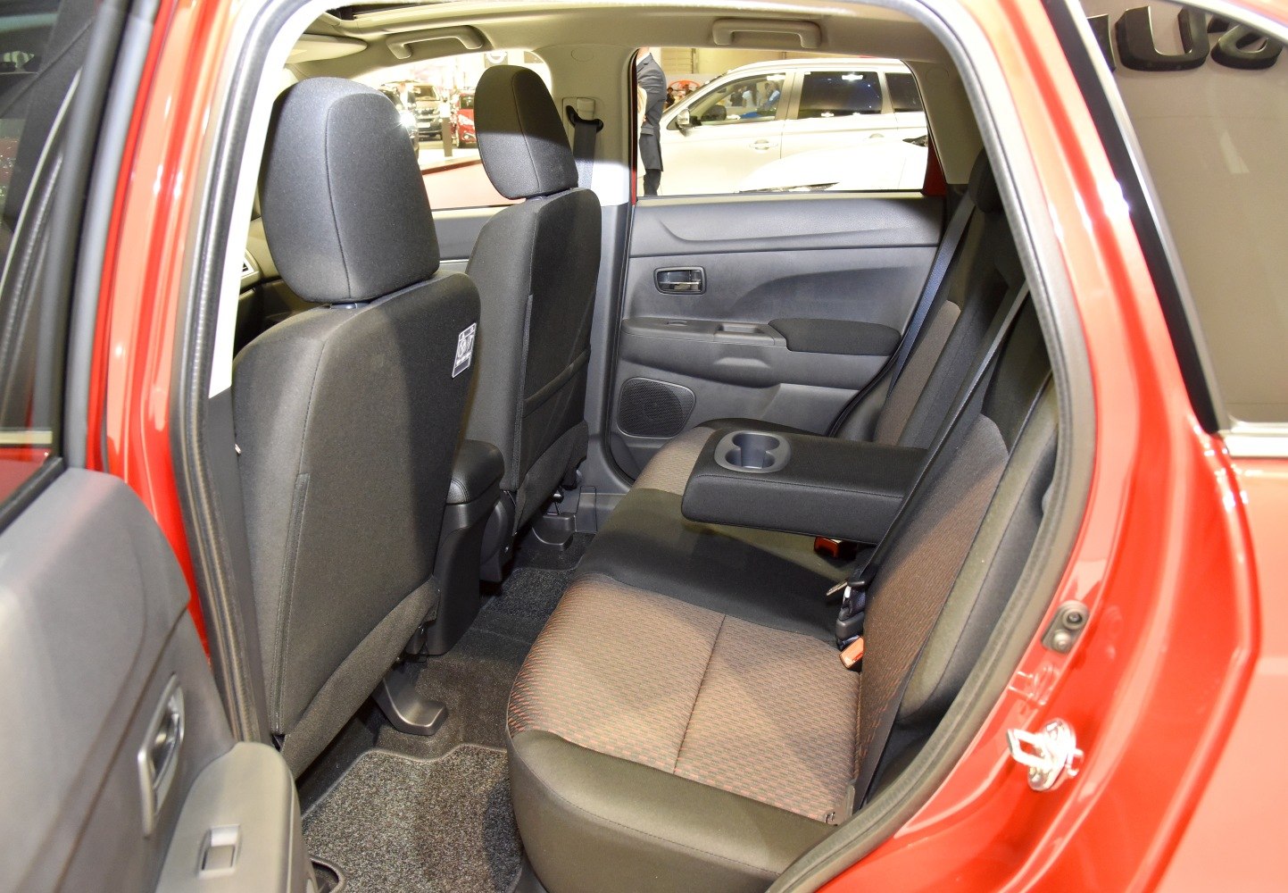 Fabric rear seats with fold-down armrest and cup holders in compact SUV