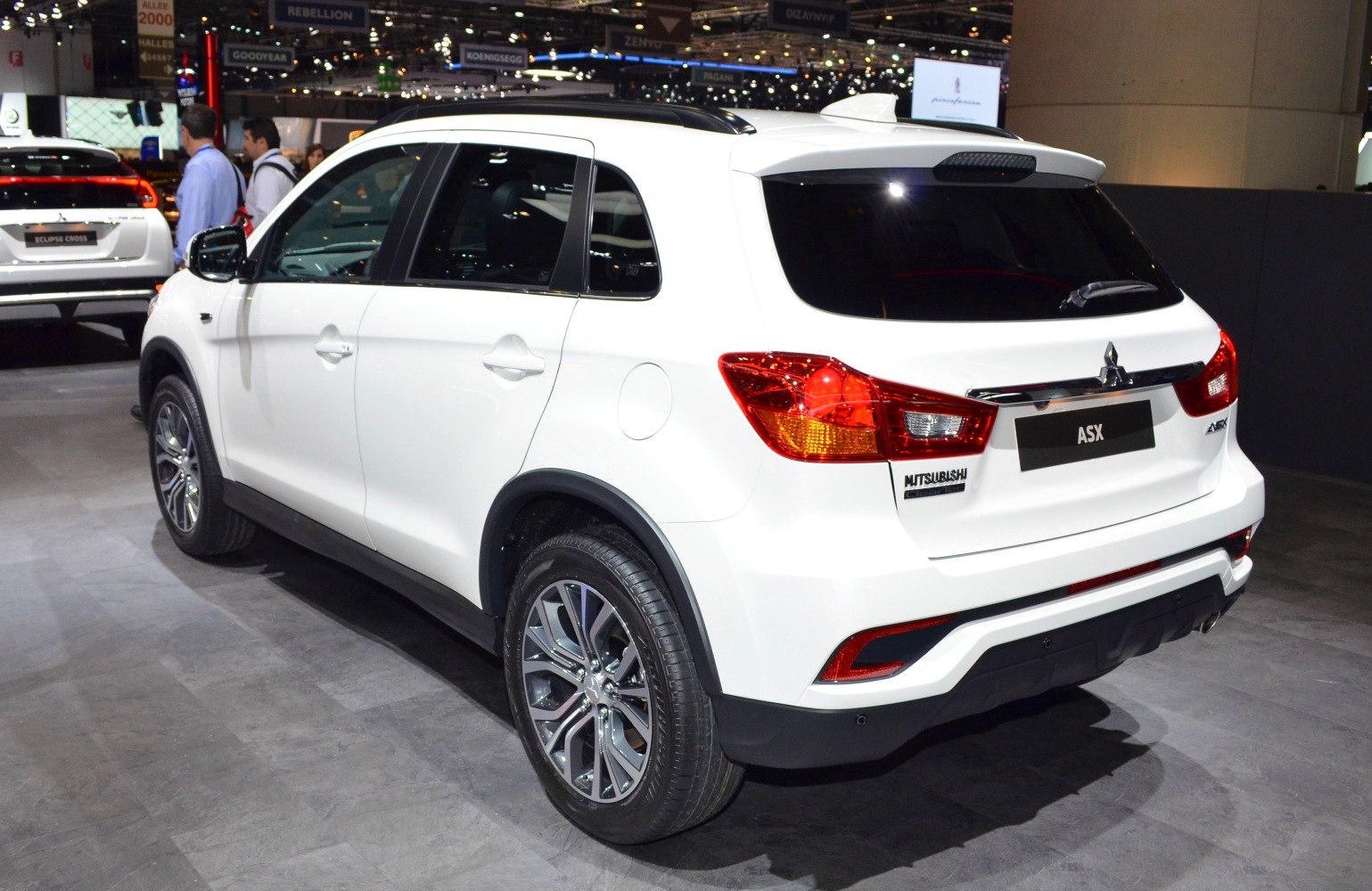 Rear view with alloy wheels and distinctive taillights