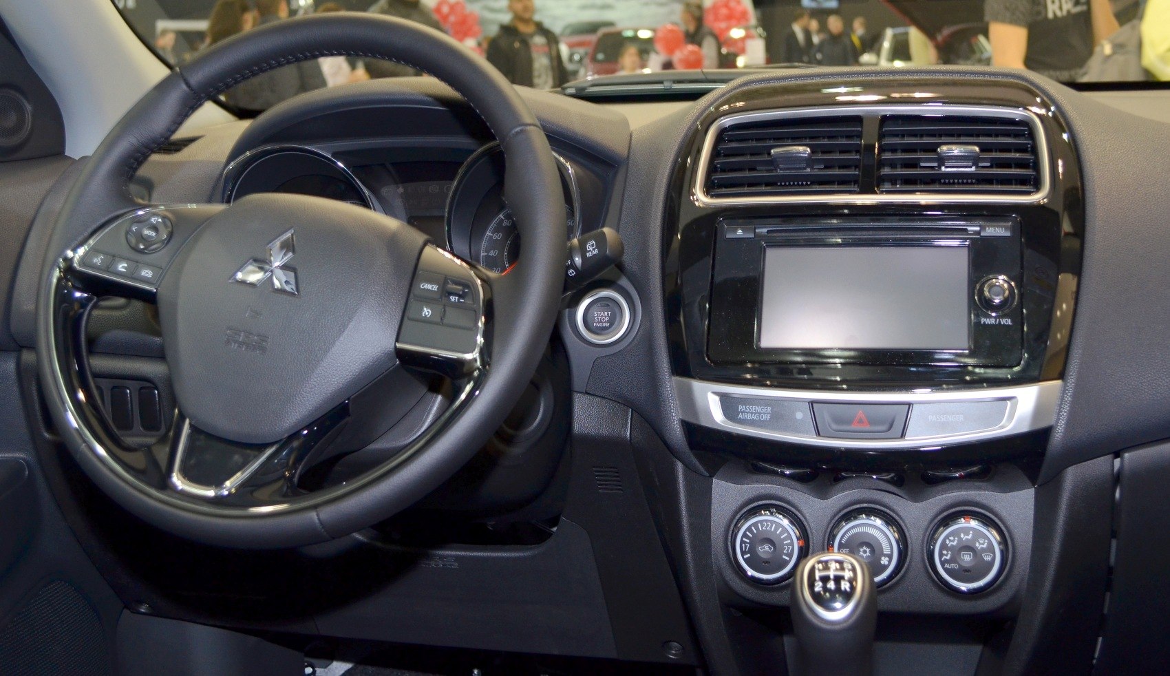 Steering wheel and dashboard with control panel and gear stick
