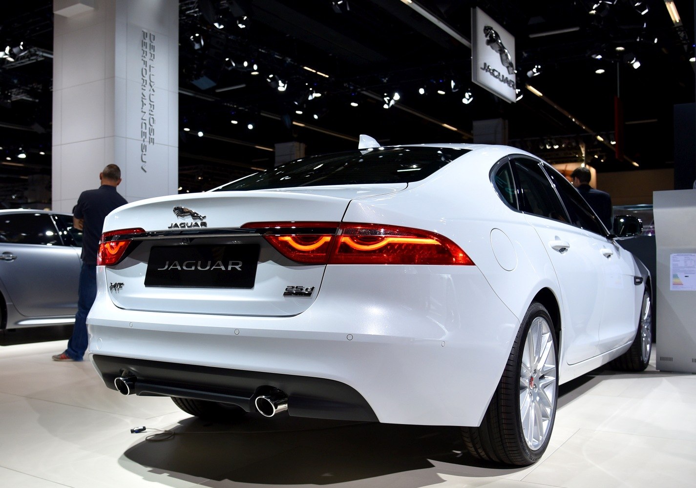 Rear view with distinct tail lights and dual exhaust of a luxury sedan