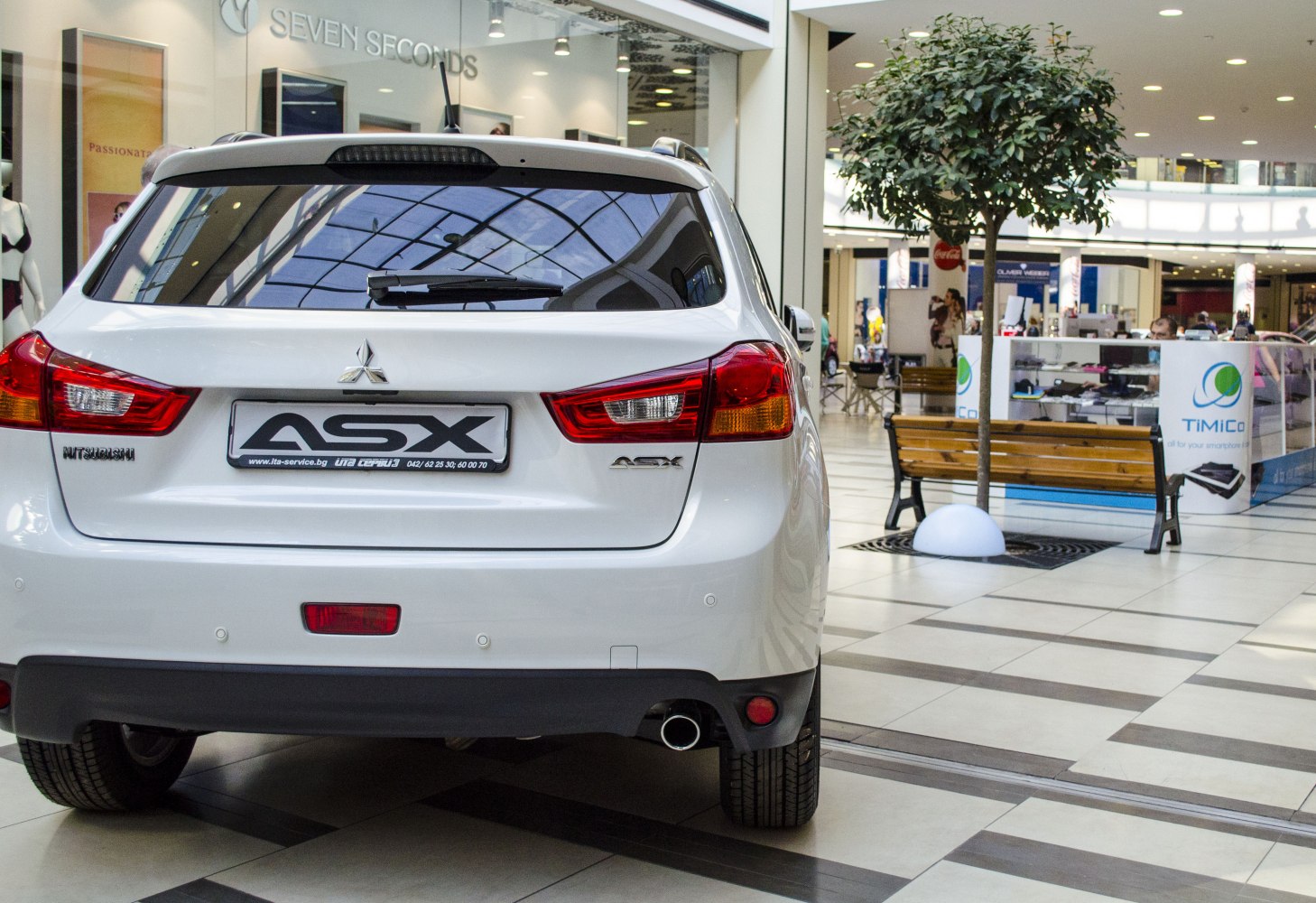 Rear view with tail lights, rear window, and exhaust pipe