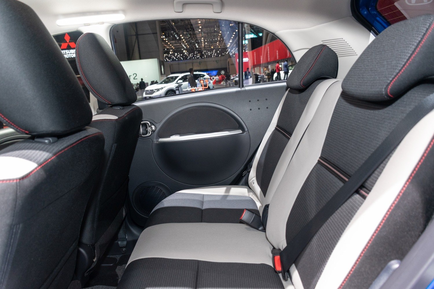 Rear seat interior with fabric upholstery and compact design