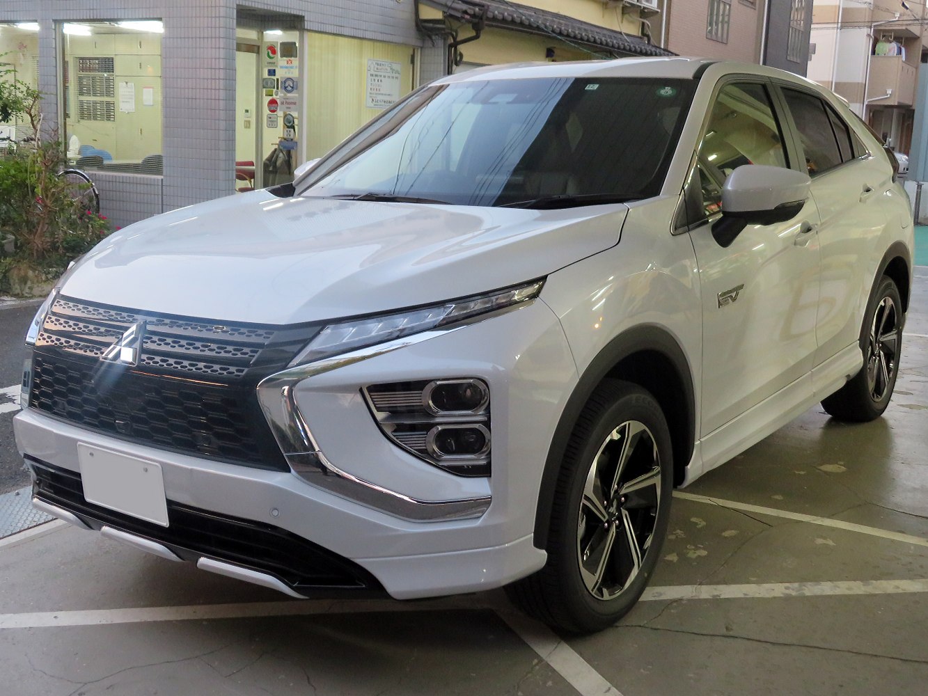 Front view with LED headlights and bold grille design