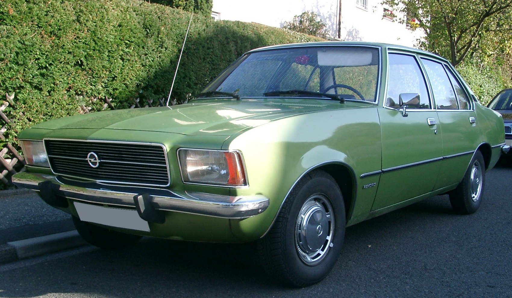 1970s sedan front with chrome grille and rectangular headlights