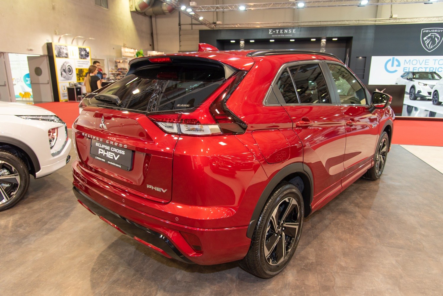 Rear view of red SUV with modern taillights and PHEV badge