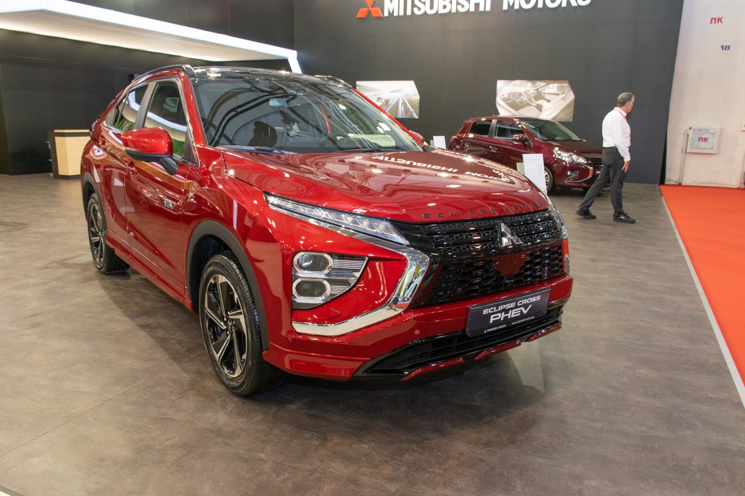 Red SUV with modern front LED lights and bold grille design