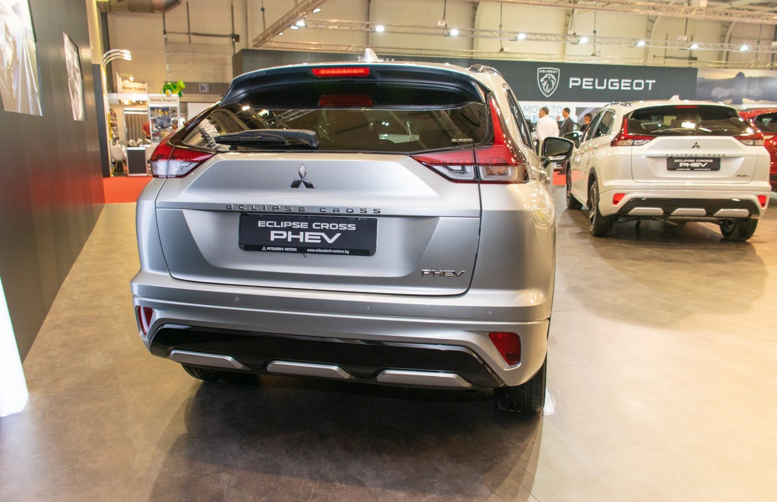 Rear view of 2021 facelift Eclipse Cross PHEV with distinct taillights and rear bumper.