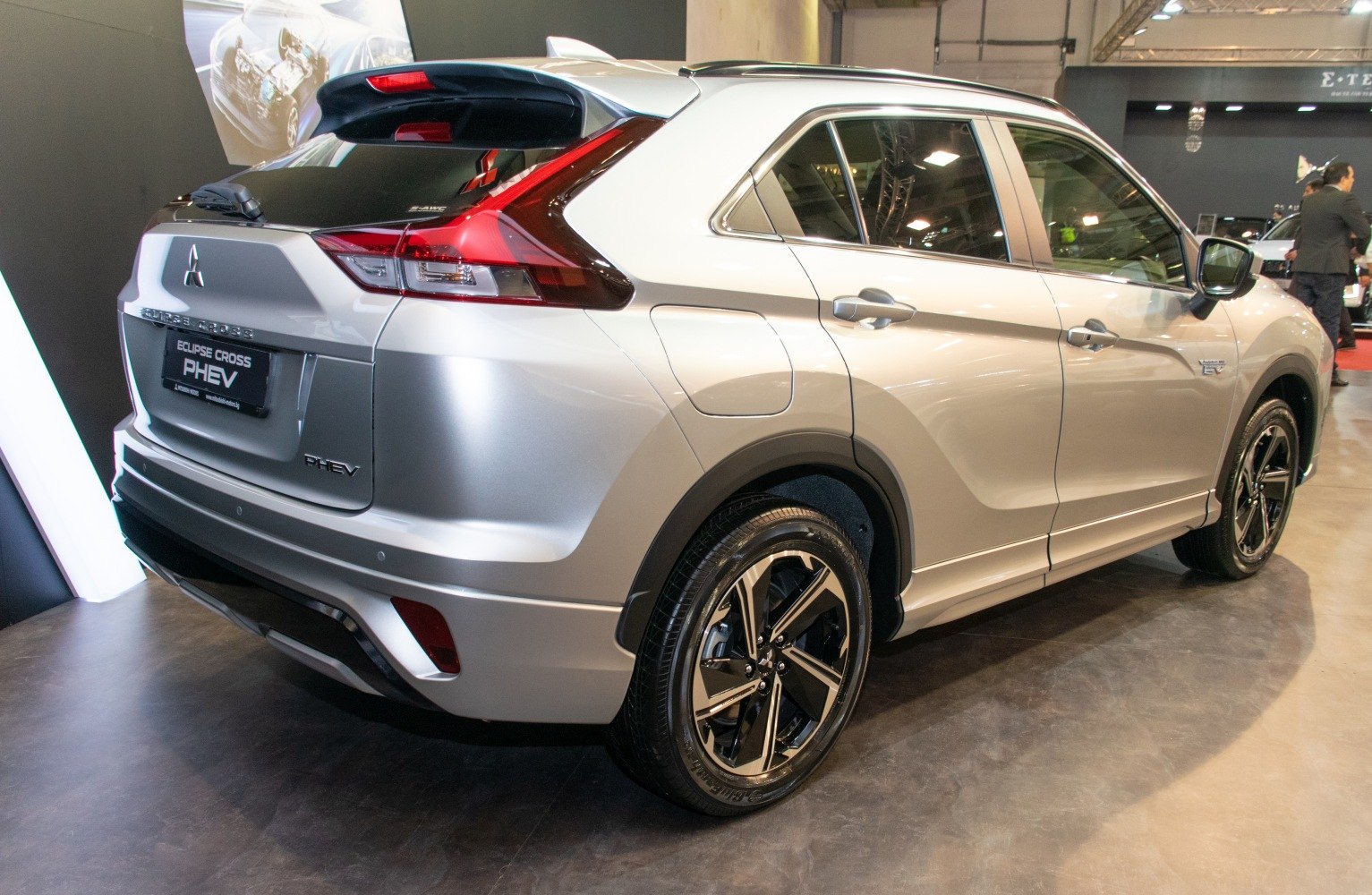 Rear side view of silver SUV with distinct taillights and alloy wheels