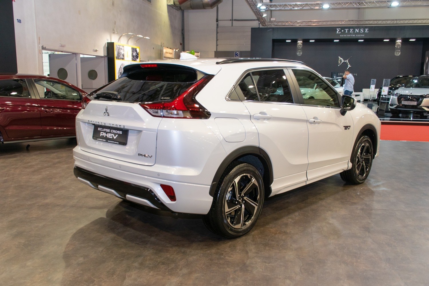 Rear-side view of white PHEV SUV with modern taillights and alloy wheels
