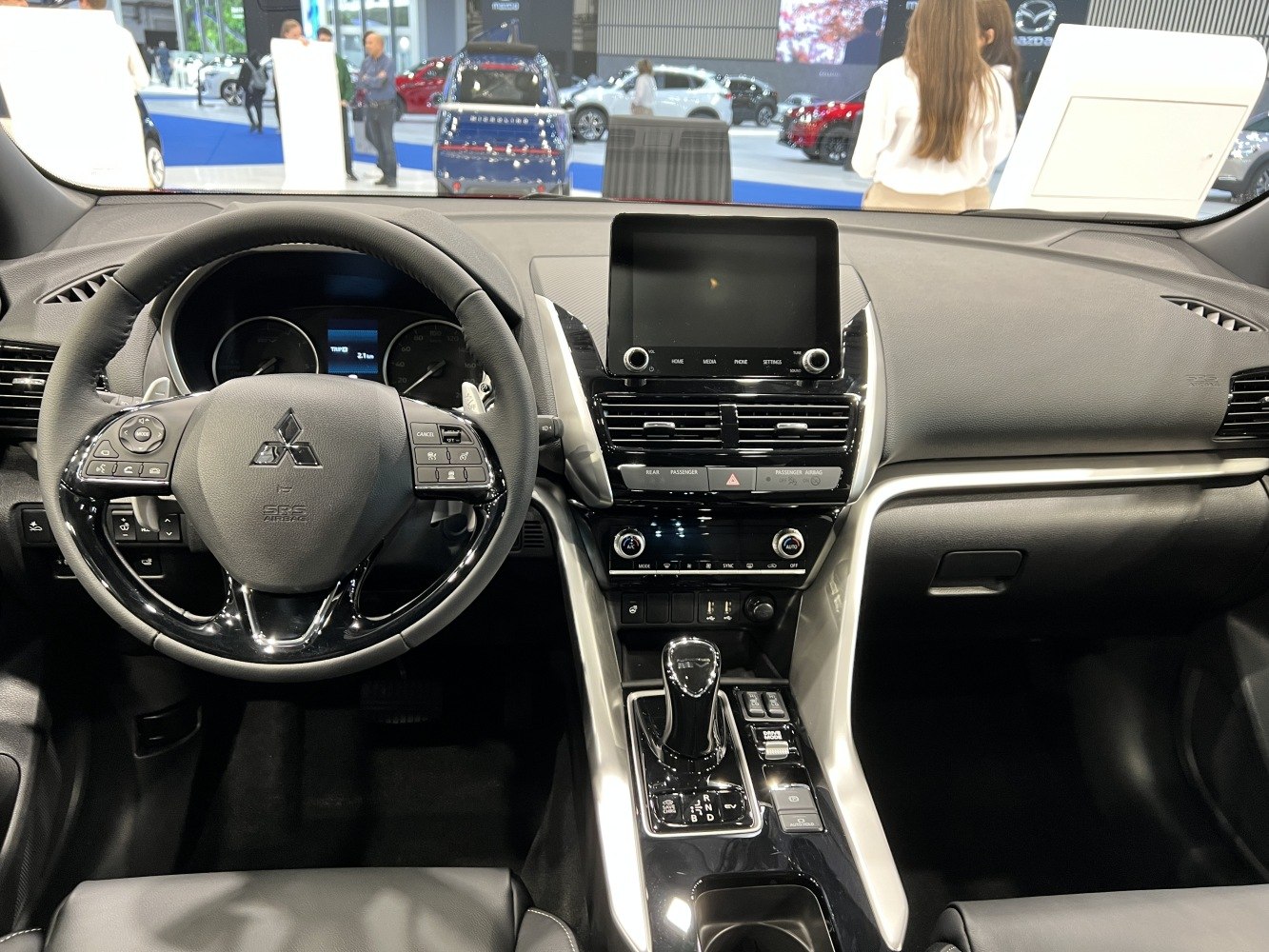 Modern car interior with steering wheel and central touchscreen display