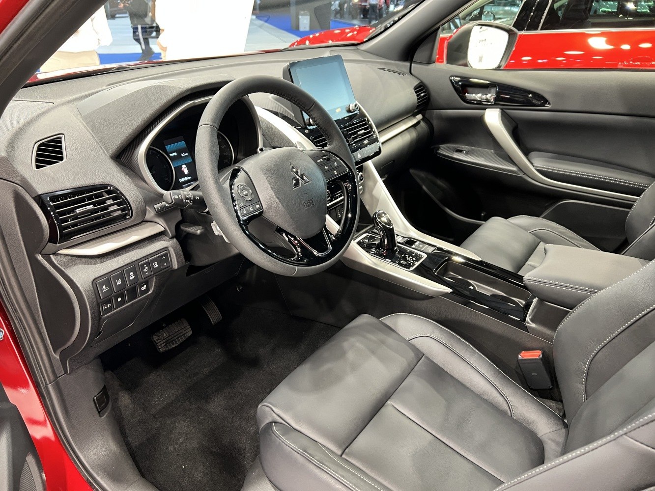 Modern car interior with touchscreen display and multifunction steering wheel