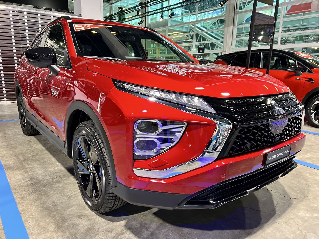 Front view showcasing LED headlights and bold grille design