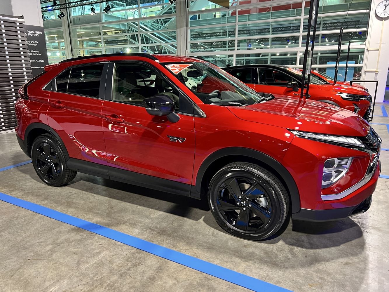 Red crossover with black alloy wheels and modern LED front lights