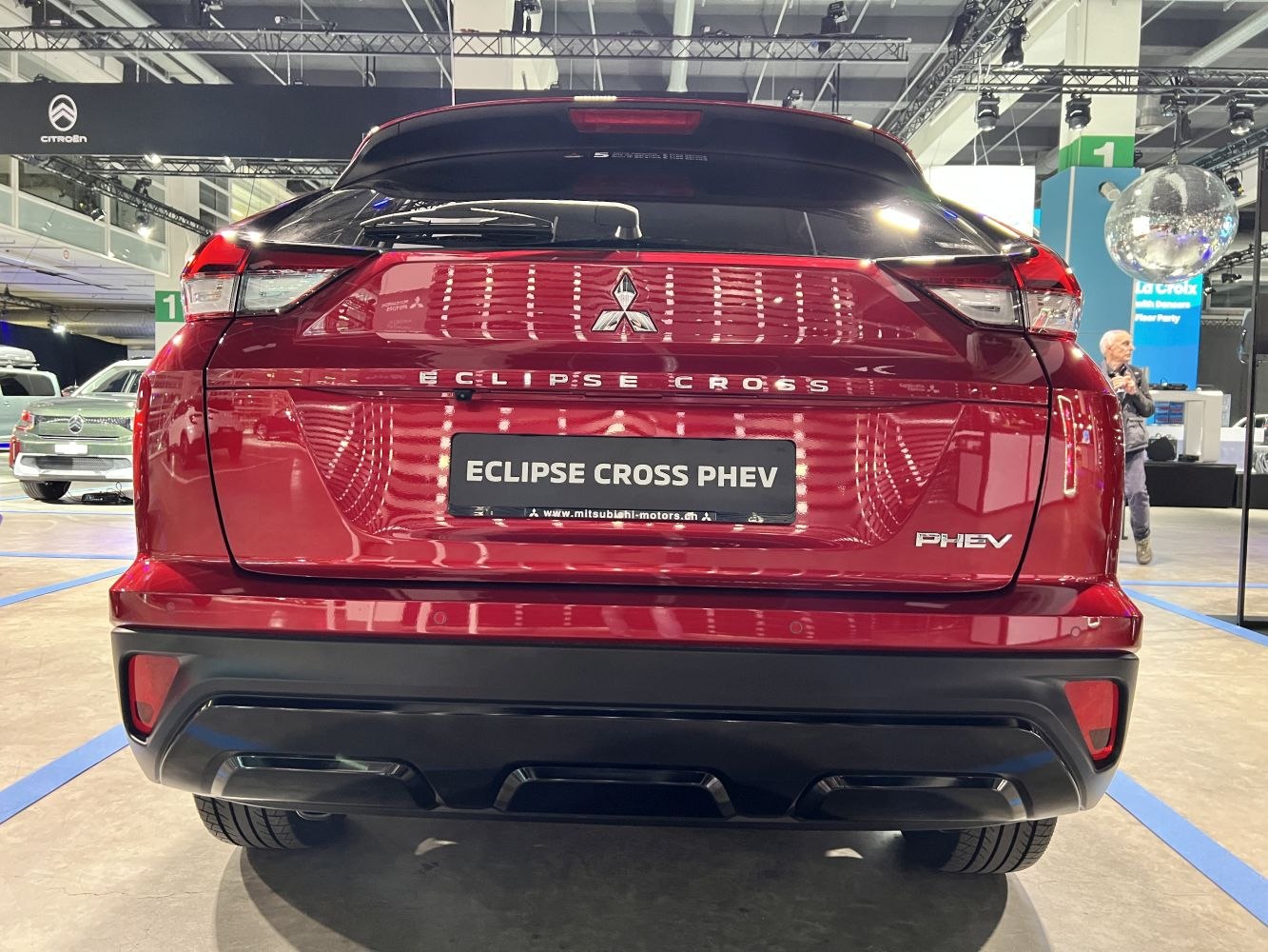 Rear view of a red SUV with PHEV badge and modern taillight design