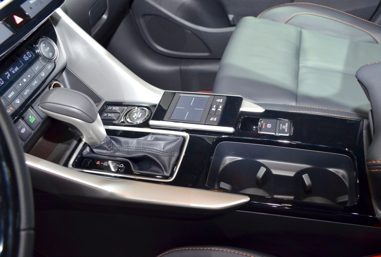 Gear shift and central control panel with cup holders and electronic parking brake