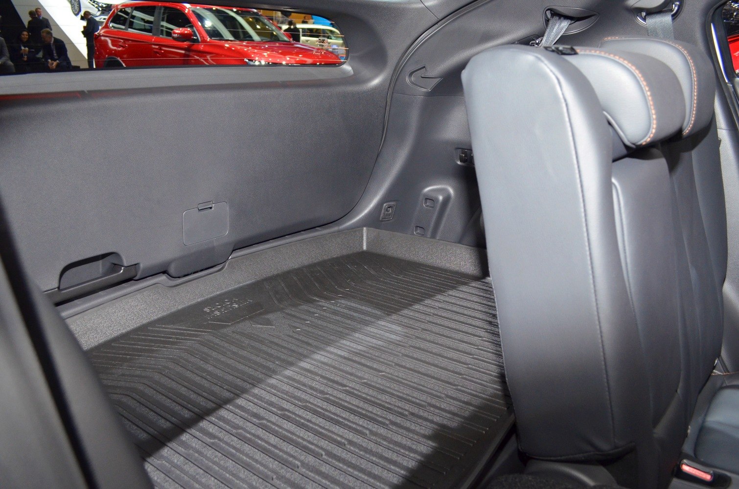 Spacious cargo area with folded rear seat and durable floor mat