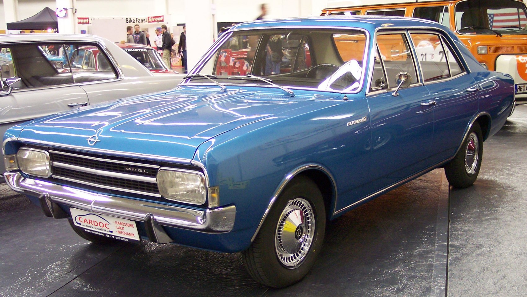 Vintage blue sedan with rectangular headlights and chrome trim.