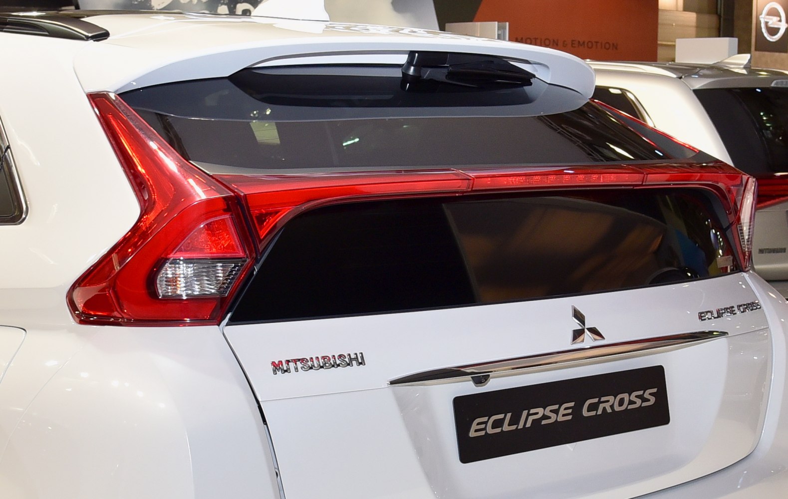 Rear tail light and spoiler design with rear window wiper.