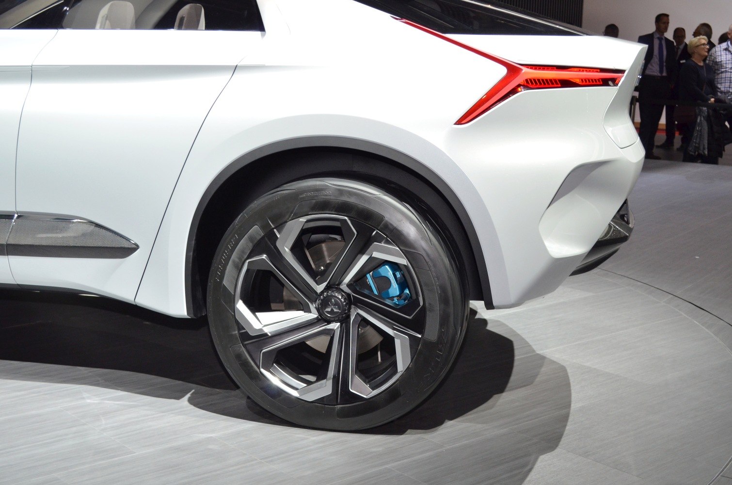 Rear wheel rim and angular tail light design of a white concept SUV