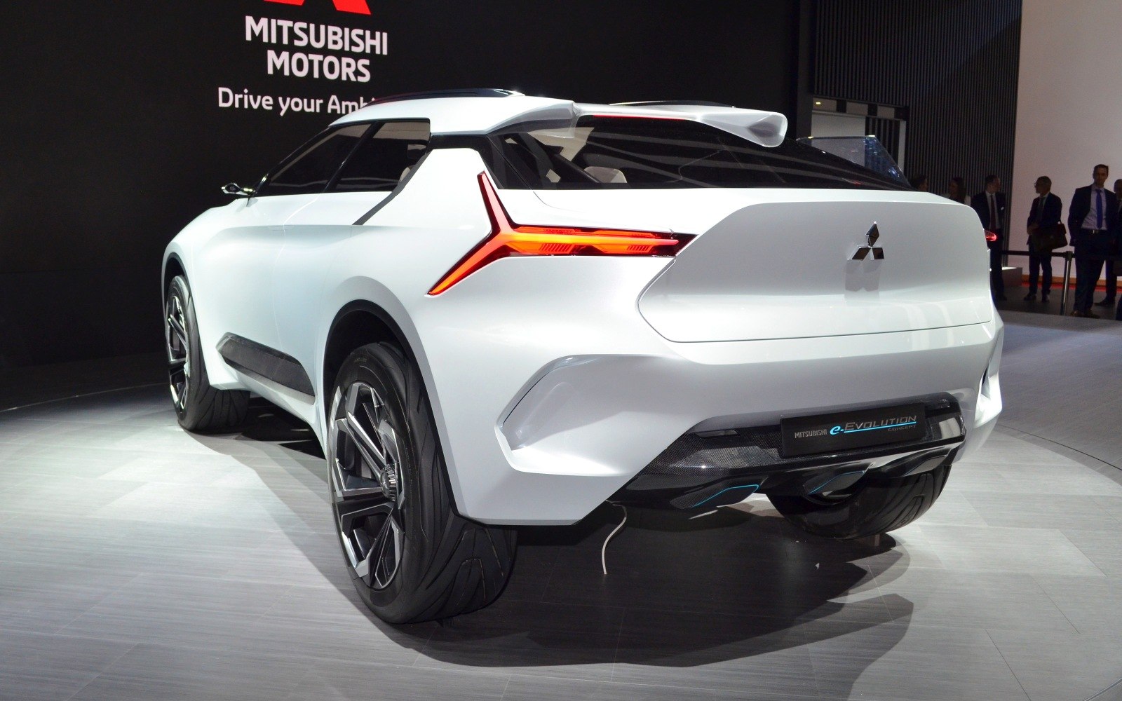 Futuristic electric SUV rear with distinctive LED taillights and carbon fiber diffuser