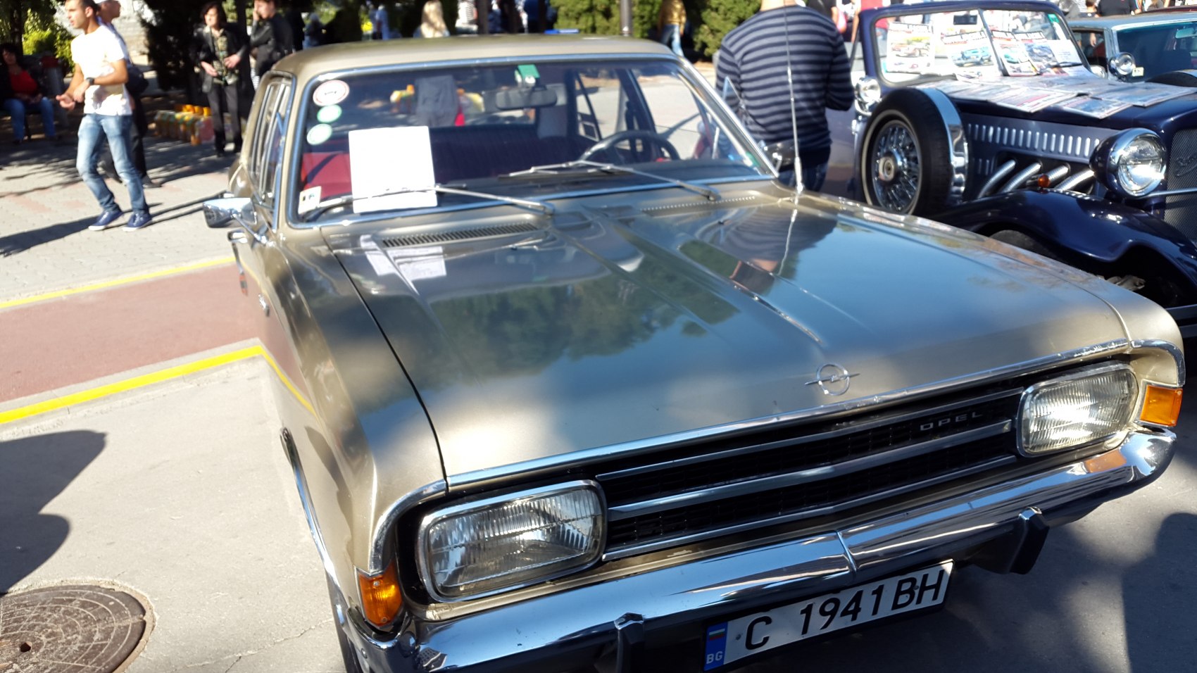 Front view of vintage sedan with rectangular headlights and chrome grille