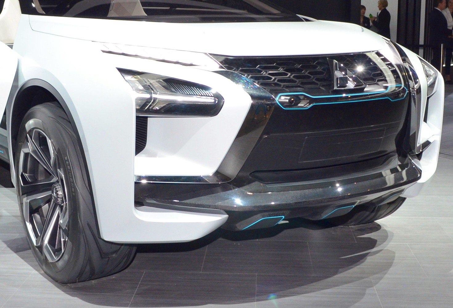 Close-up of front grille and headlight design with alloy wheel