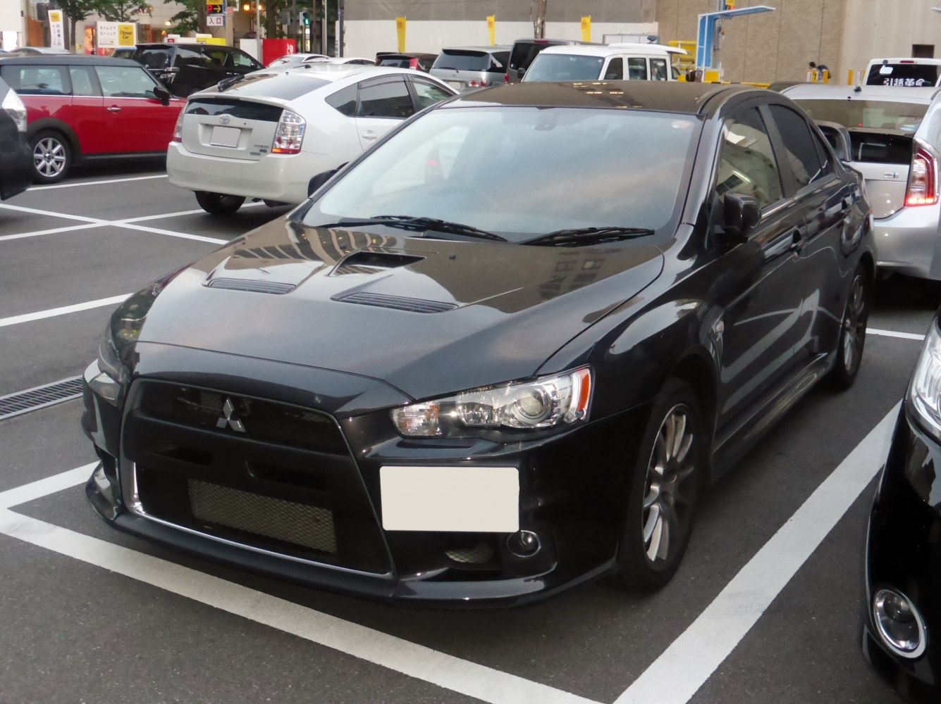 Sport sedan with wide front grille and dual hood vents
