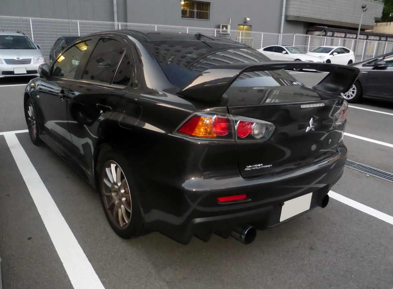 Rear view with large spoiler and dual exhaust