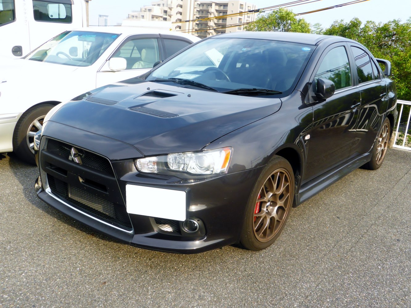 Aggressive front with hood air vents and bronze sport wheels