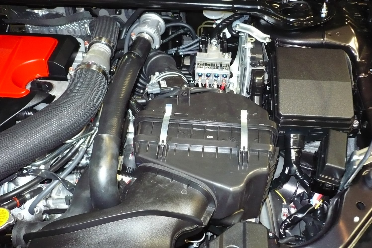Close-up of engine bay with air intake system and engine components