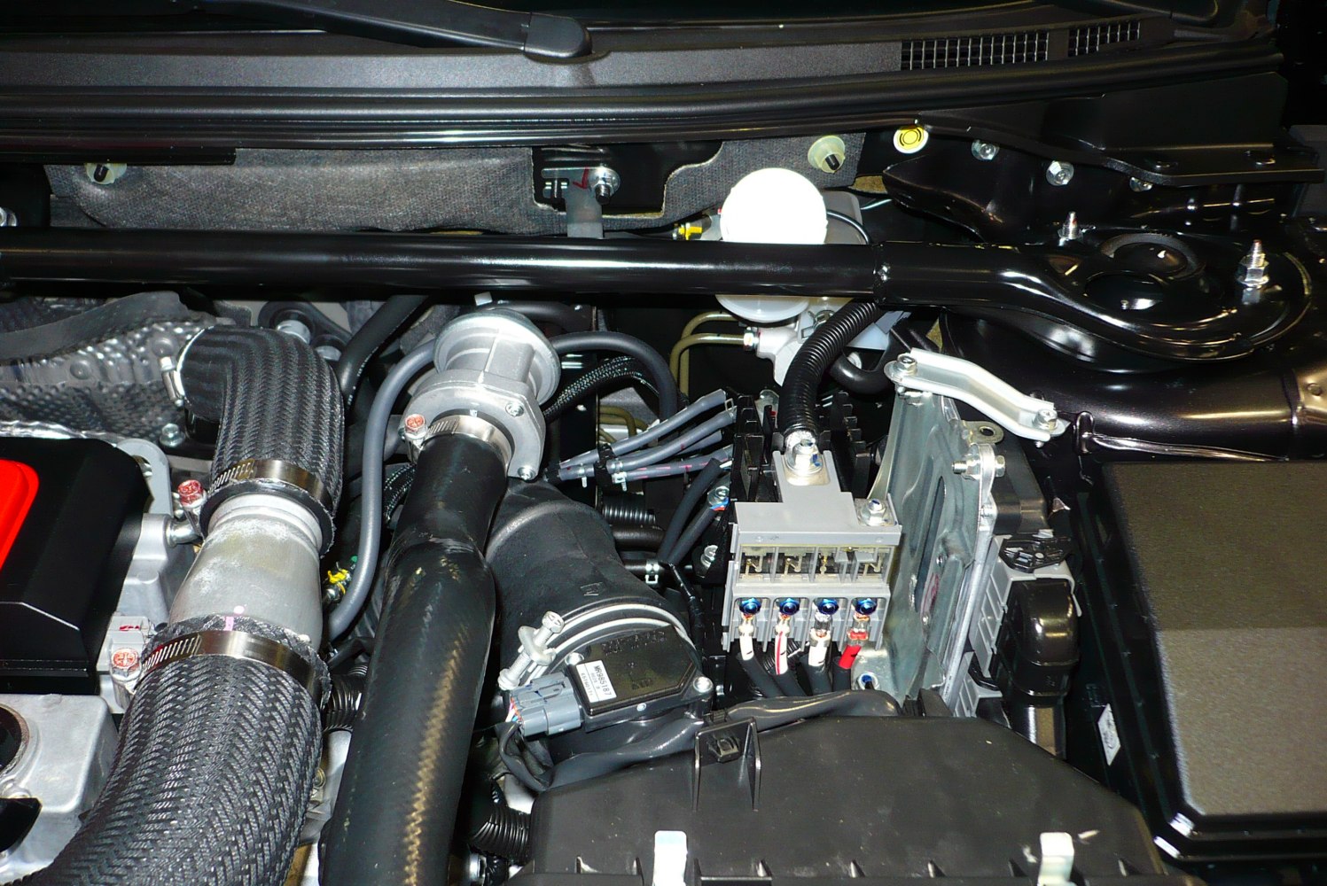 Engine bay with turbo piping and wiring harness