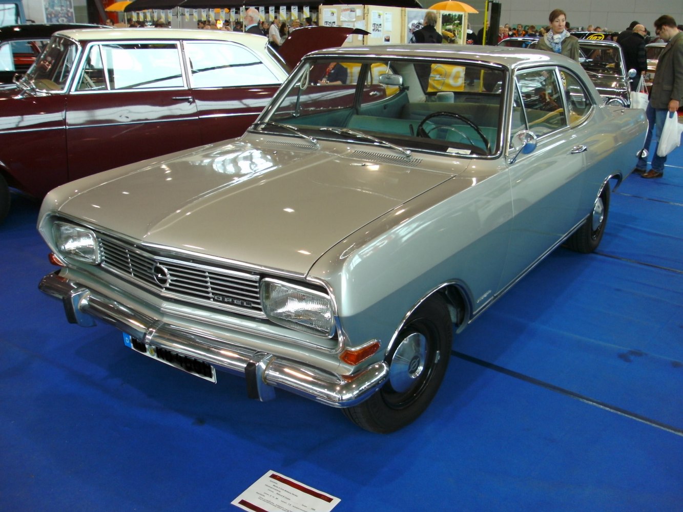 Front grille, rectangular headlights, chrome bumper of classic coupe