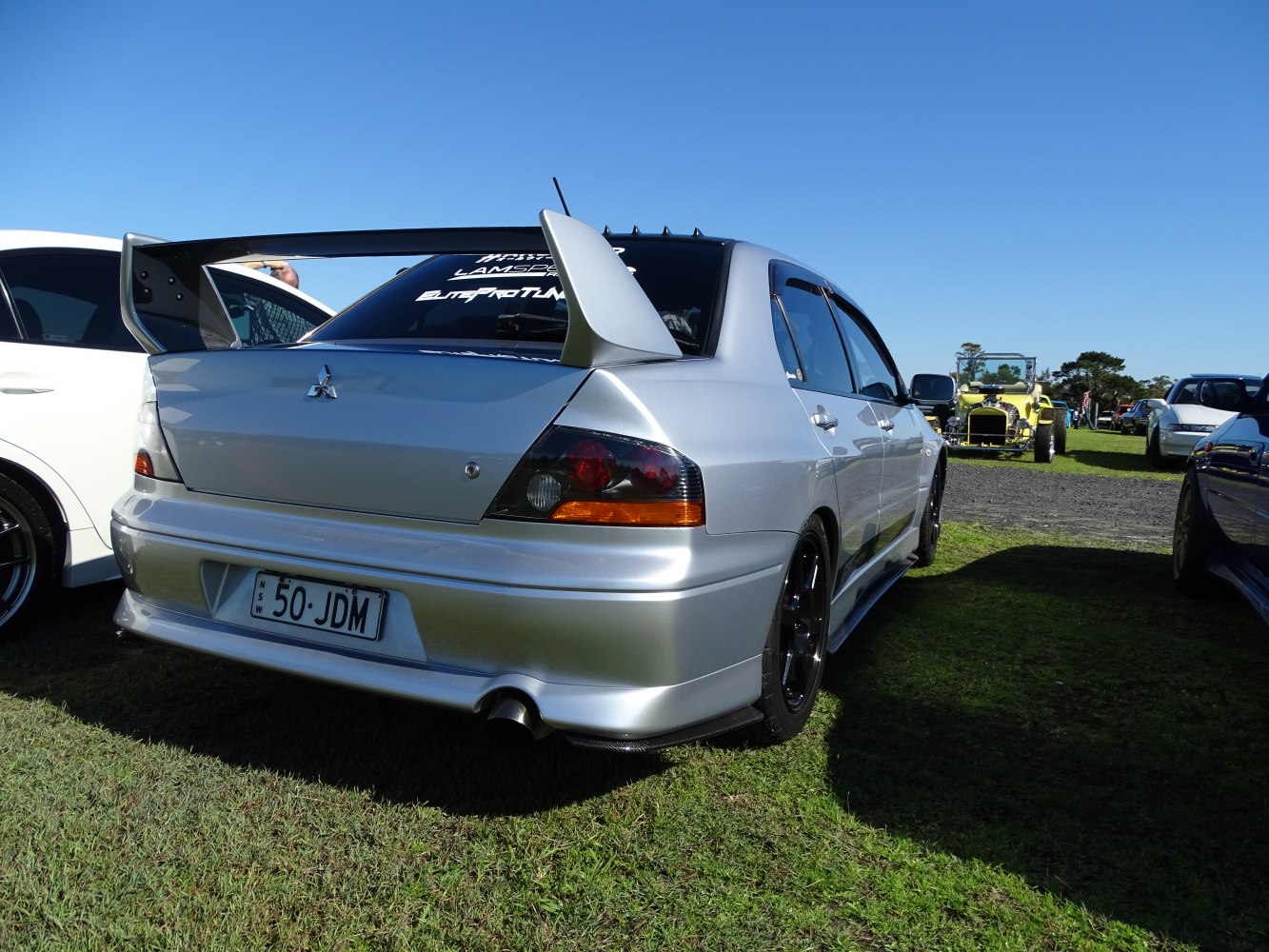 Rear view with large spoiler and sport exhaust