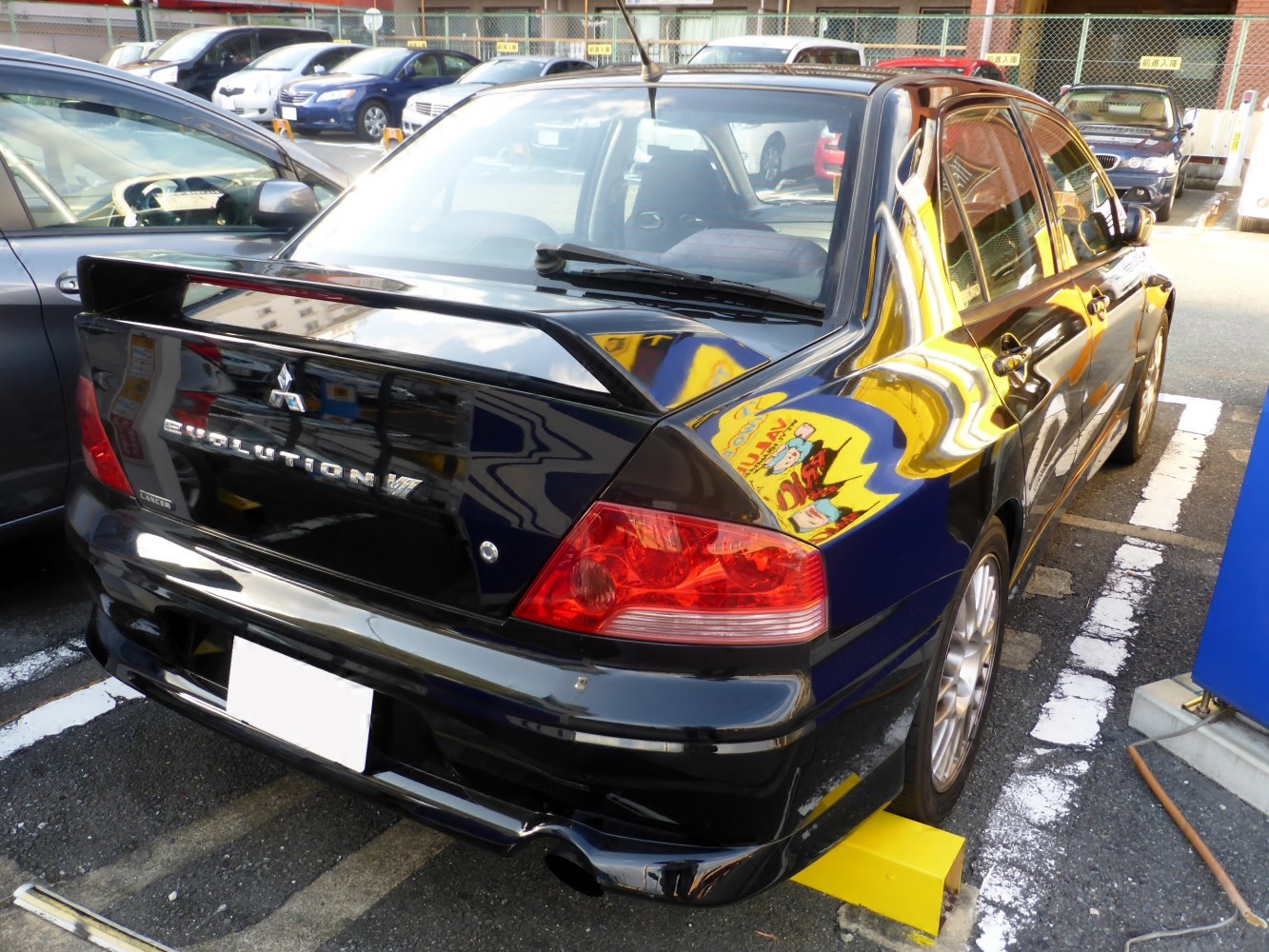Rear spoiler and sports sedan taillights