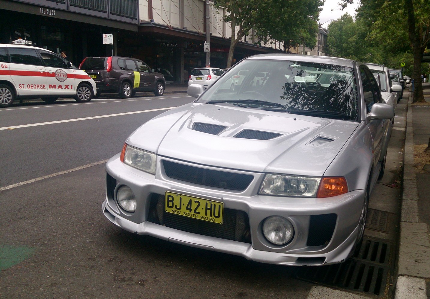 Front view with prominent hood vents and sporty bumper