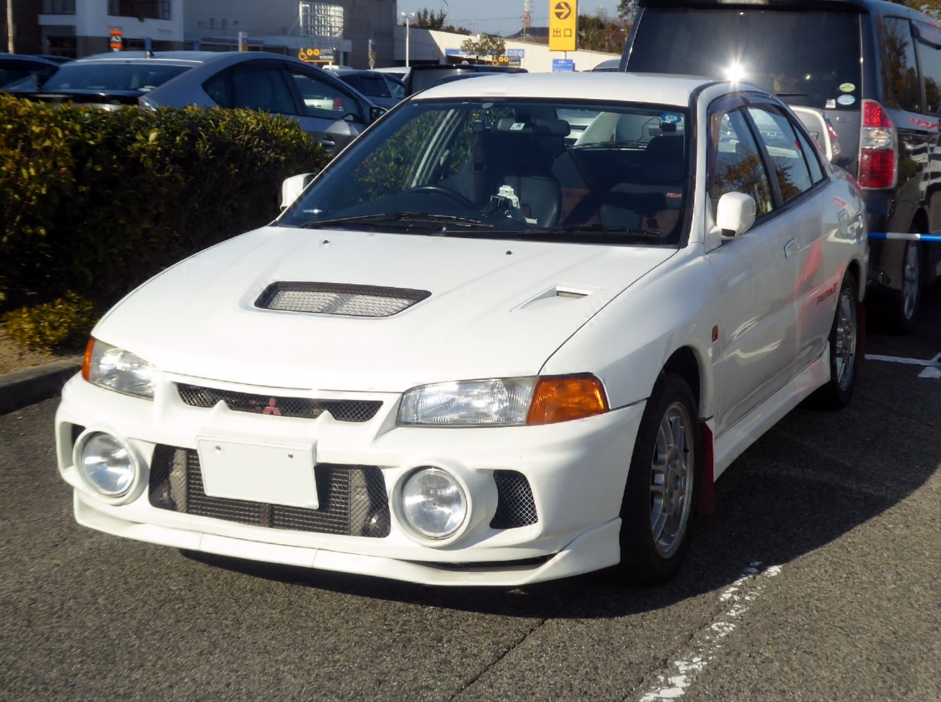 Front-angle view with distinctive hood vents and round fog lights